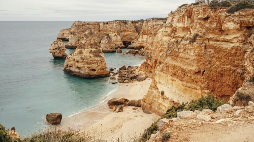 A serene coastal scene with towering cliffs and a secluded beach,perfect for tranquility.How to Make Money on Bigo Live:A Comprehensive Guide offers insights into leveraging live streaming for income.